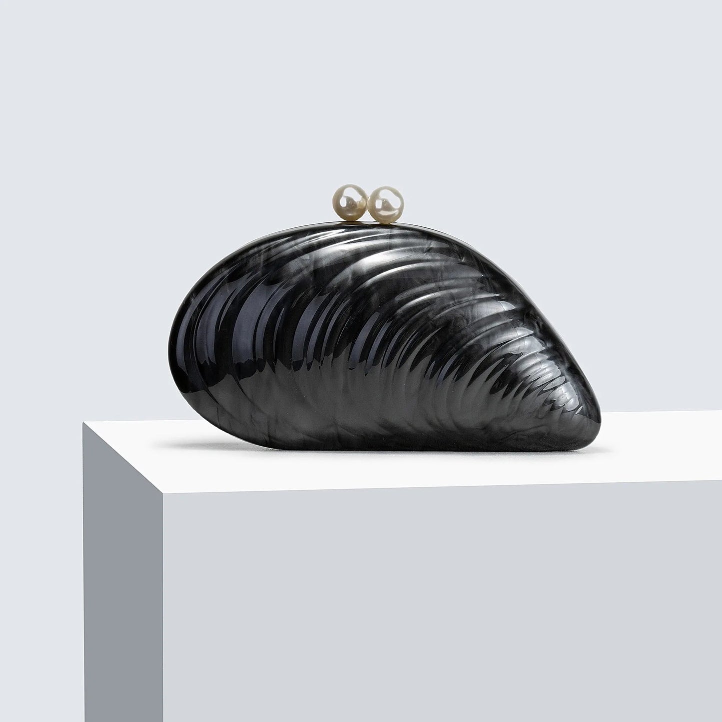 Sophia Snäckformad Clutch