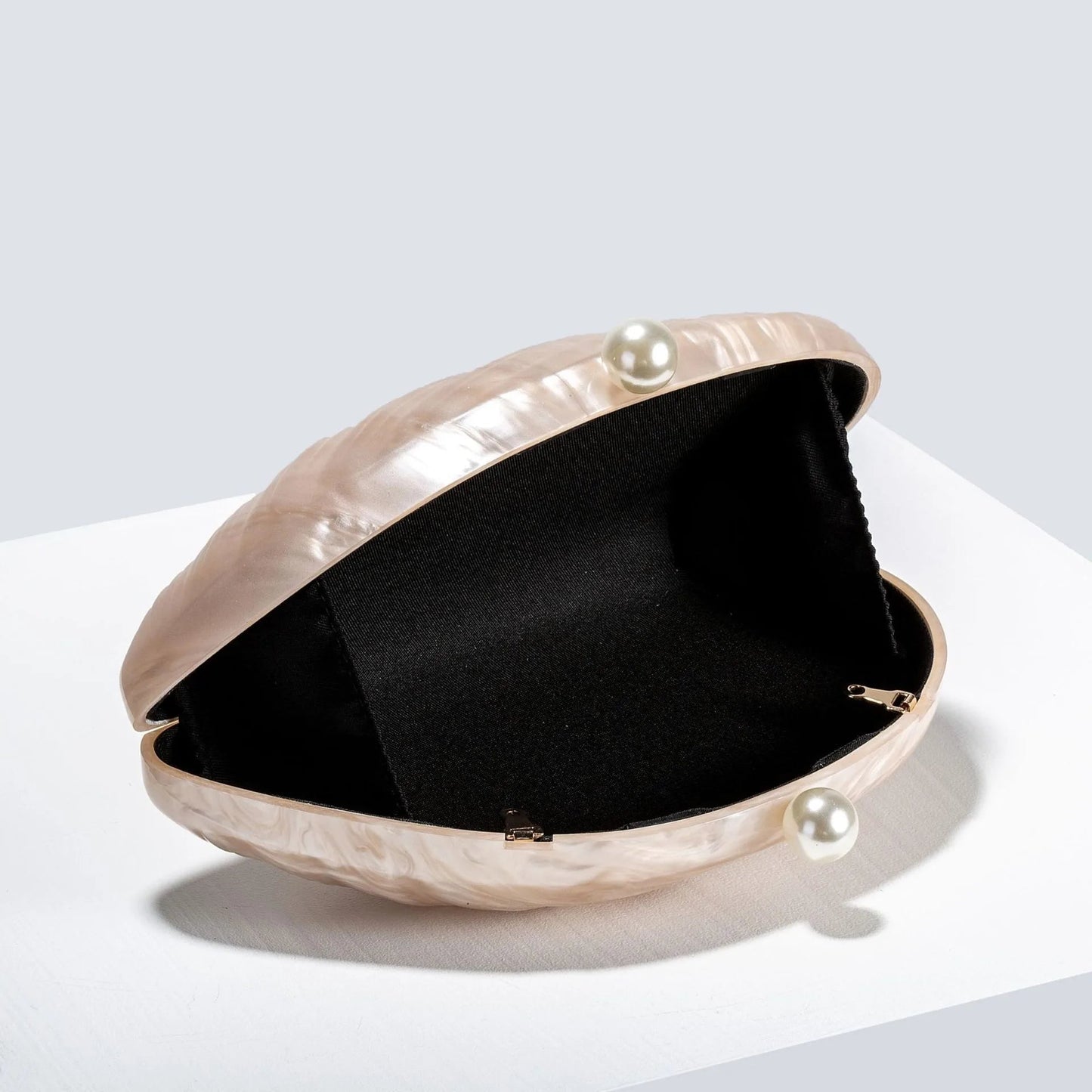 Sophia Snäckformad Clutch