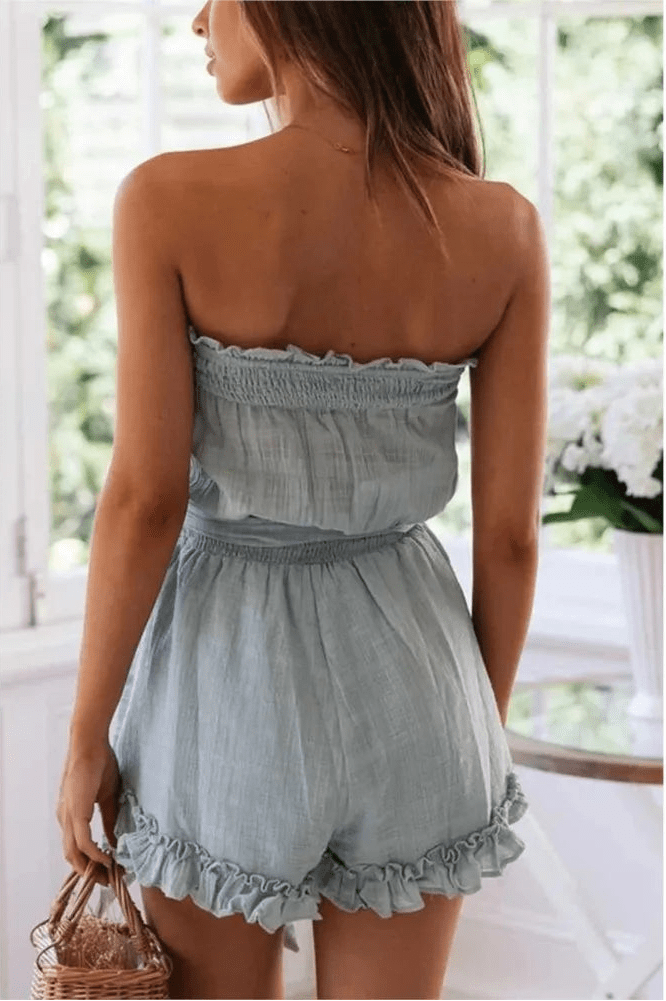 Sophie axelbandslösa jumpsuit med skärp